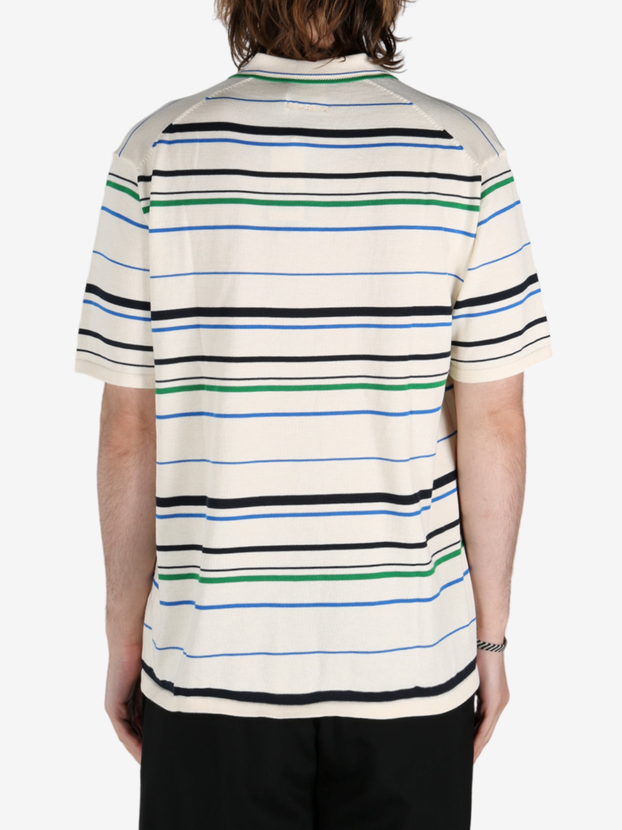 Tan shirt worn by a person, showing the shirt's fit