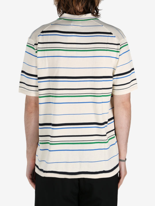 Tan shirt worn by a person, showing the shirt's fit