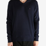 Navy sweater worn by a person, showing the sweater's fit
