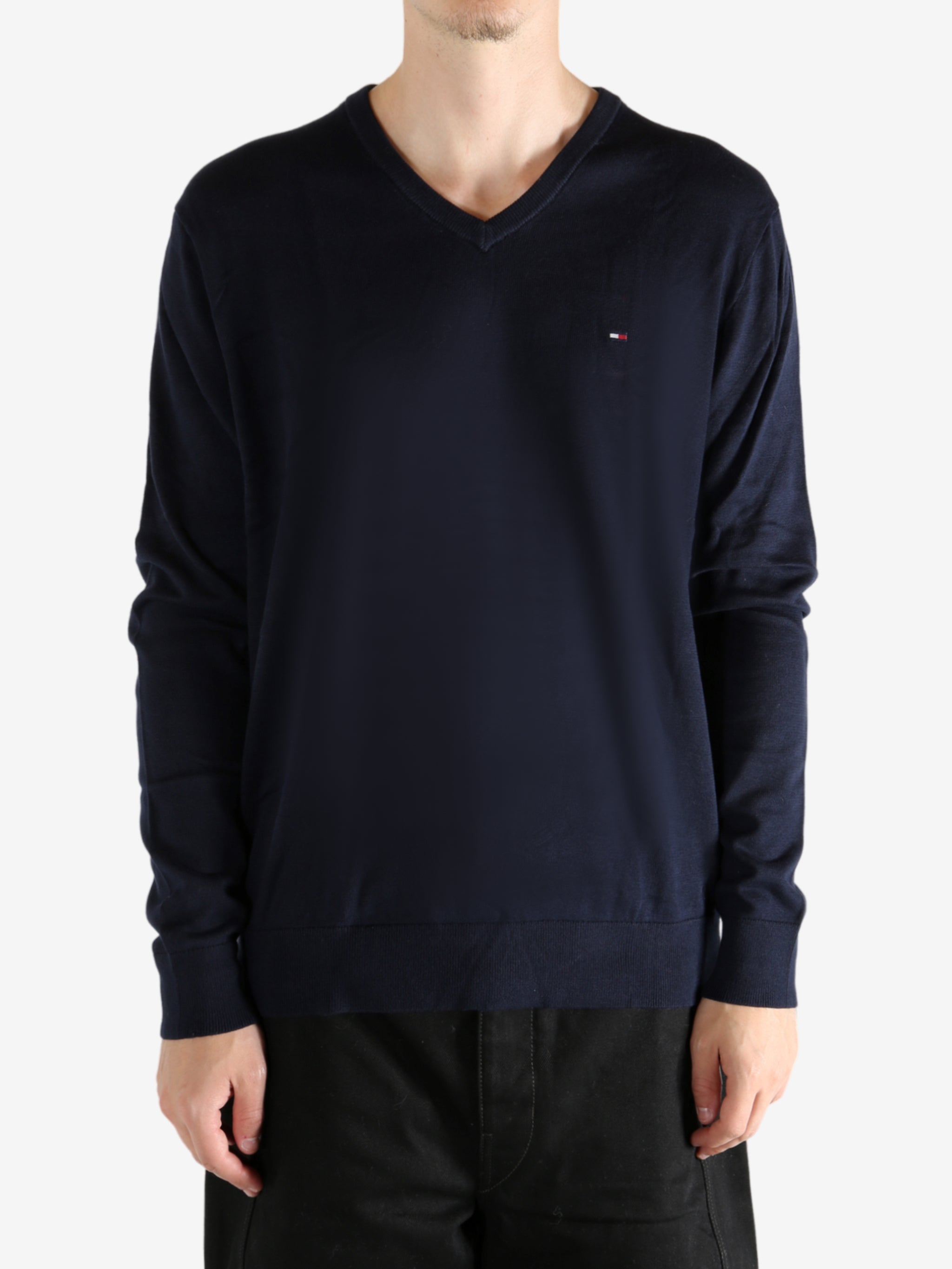 Navy sweater worn by a person, showing the sweater's fit

