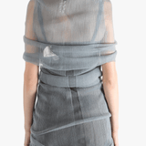 Grey shirt worn by a person, showing the tight fit.