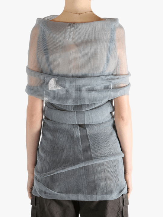 Grey shirt worn by a person, showing the tight fit.