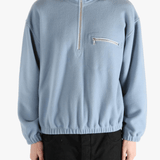 Blue hoodie worn by a person, showing the hoodie 's fit