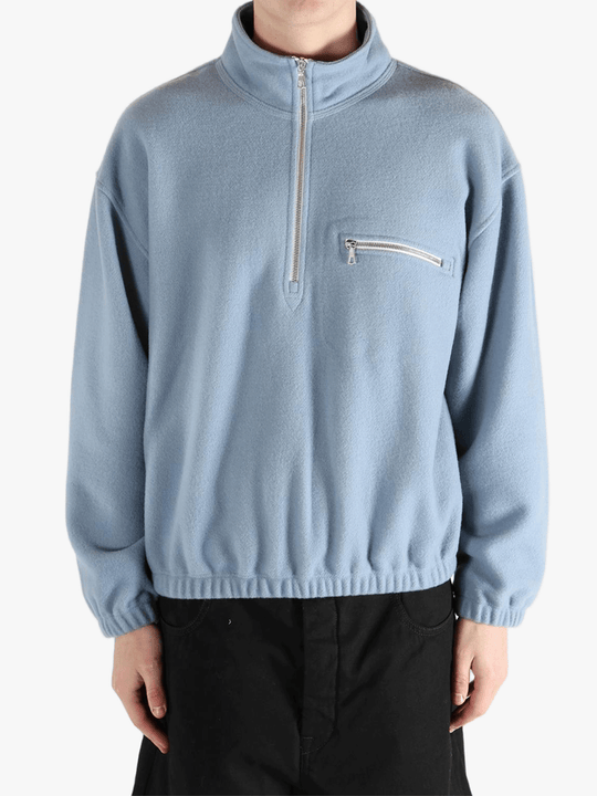 Blue hoodie worn by a person, showing the hoodie 's fit