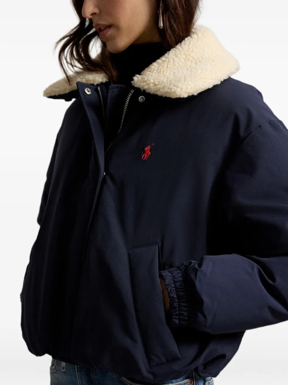 Navy jacket worn by a person, showing the jacket fit