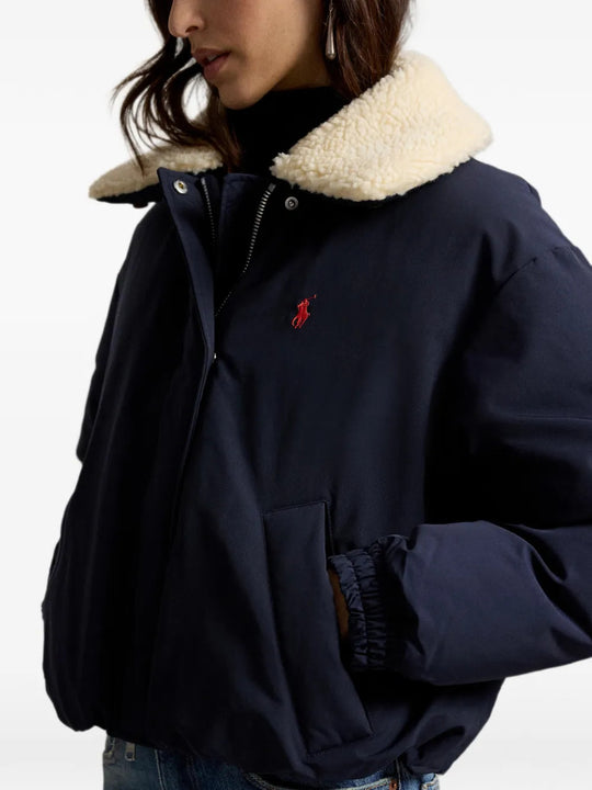 Navy jacket worn by a person, showing the jacket fit