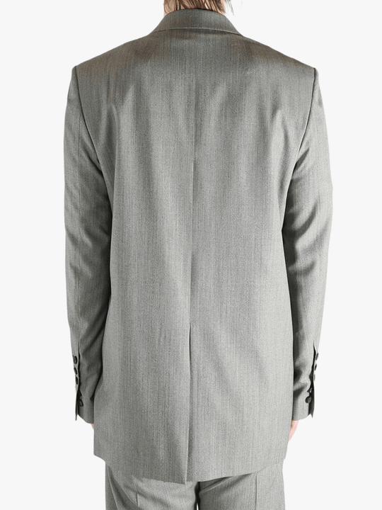 Grey jacket worn by a person, showing the jacket's fit