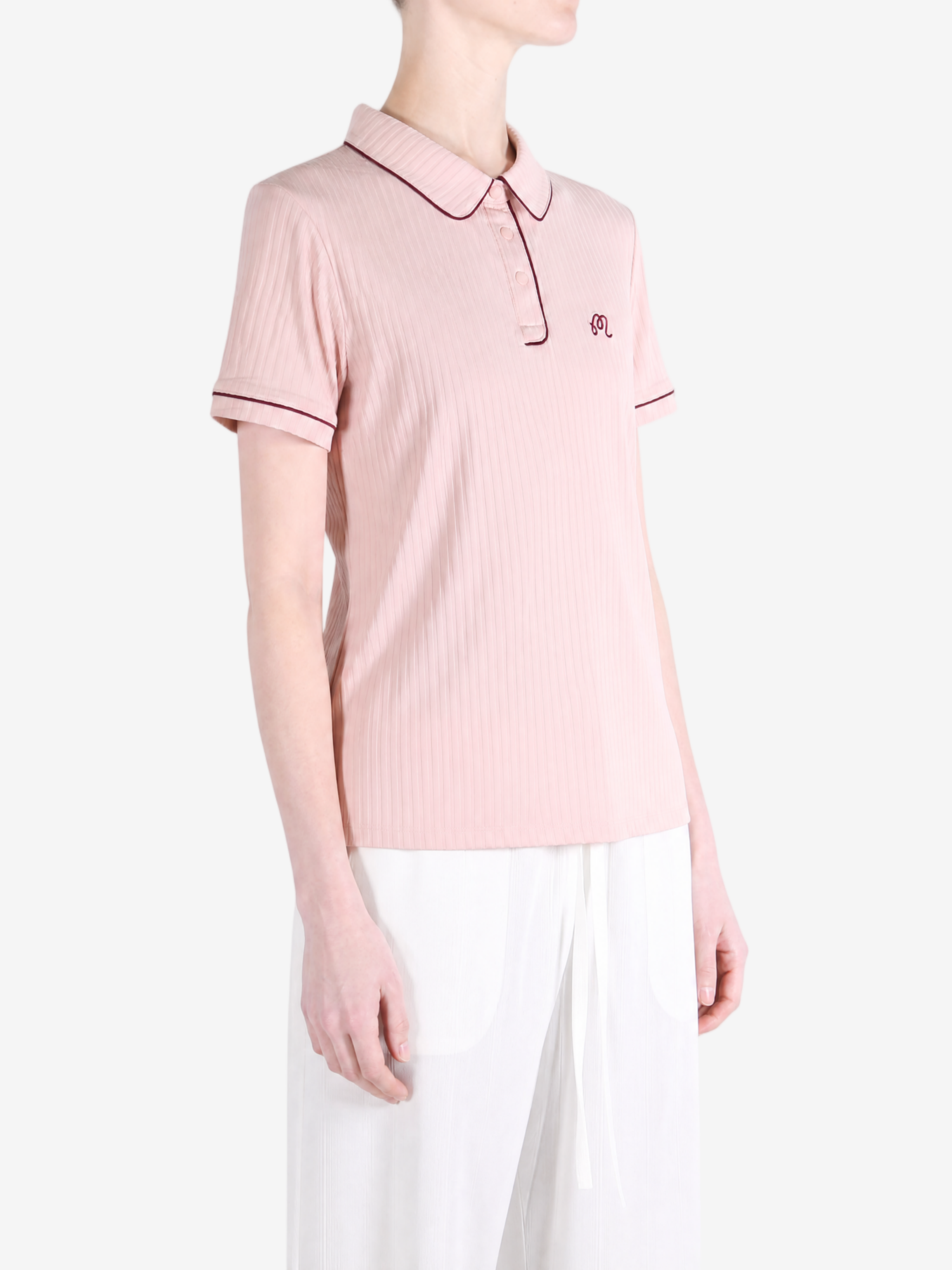Pink shirt worn by a person, showing the shirt fit