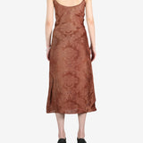 Brown dress worn by a person, showing the dress's fit