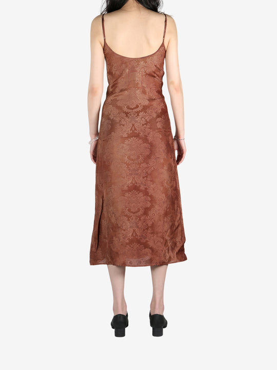 Brown dress worn by a person, showing the dress's fit