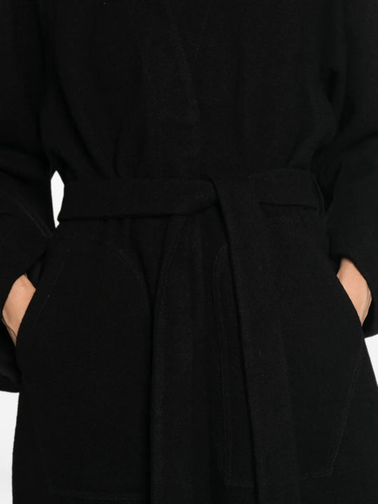 Black jacket worn by a person, showing the jacket fit