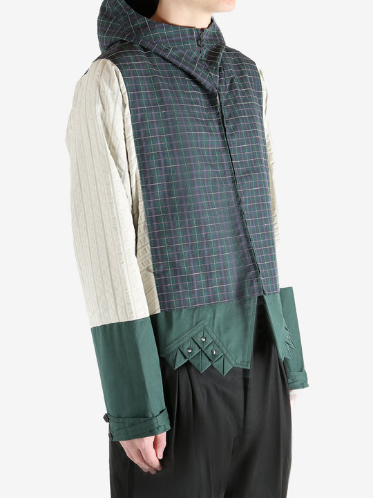 Green jacket worn by a person, showing the jacket's fit