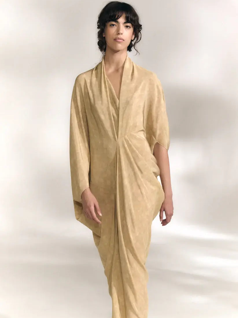 Yellow dress worn by a person, showing the dress' fit