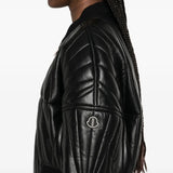 Close up of black jackets, showing texture of the calf leather fabric