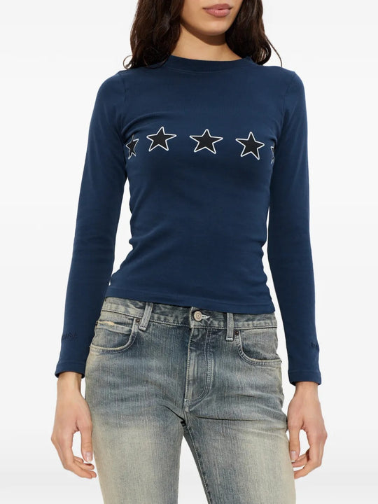 Blue tops worn by a person, showing the tops fit
