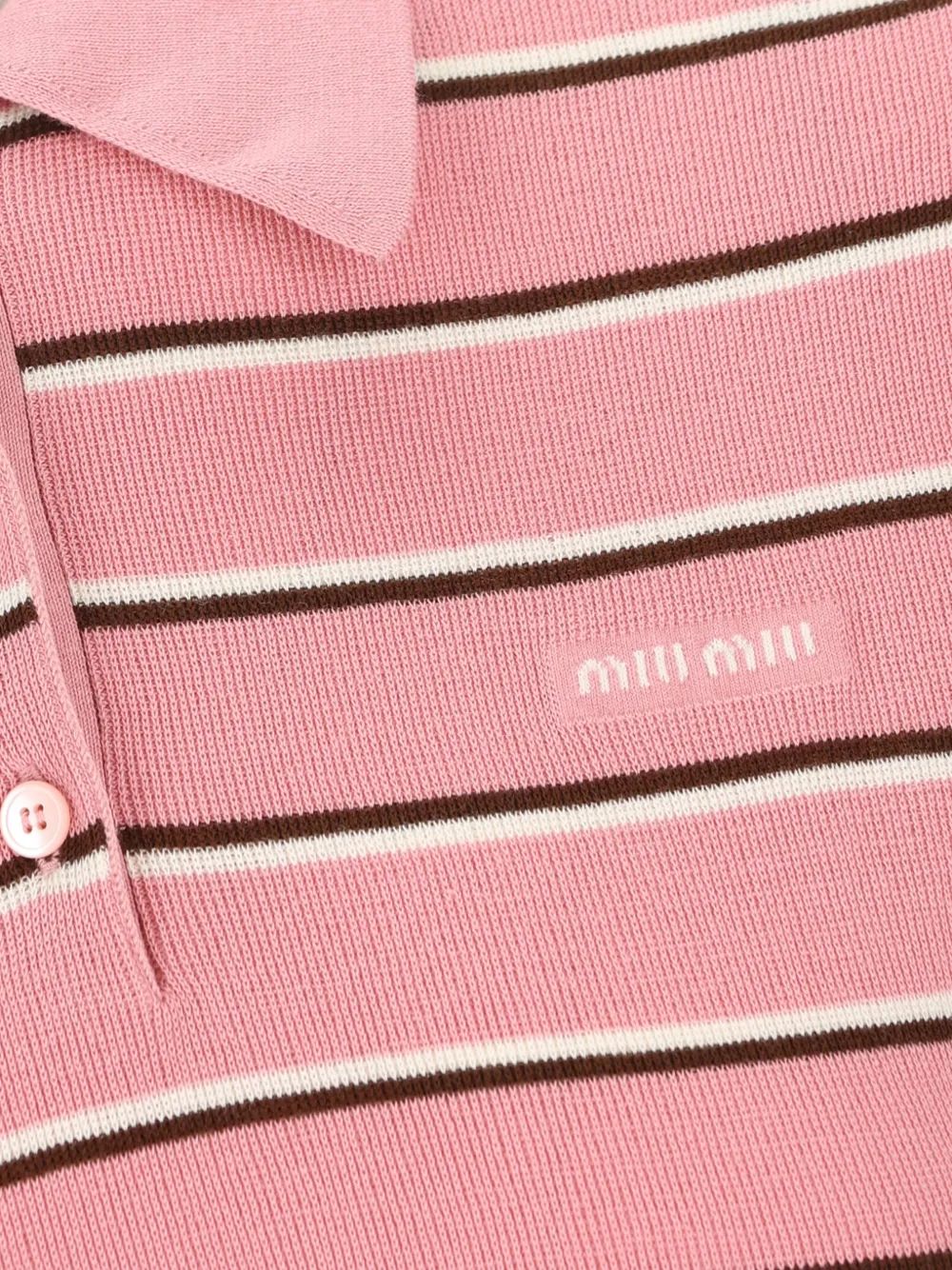 Close up of pink shirt, showing texture of the Cotton fabric