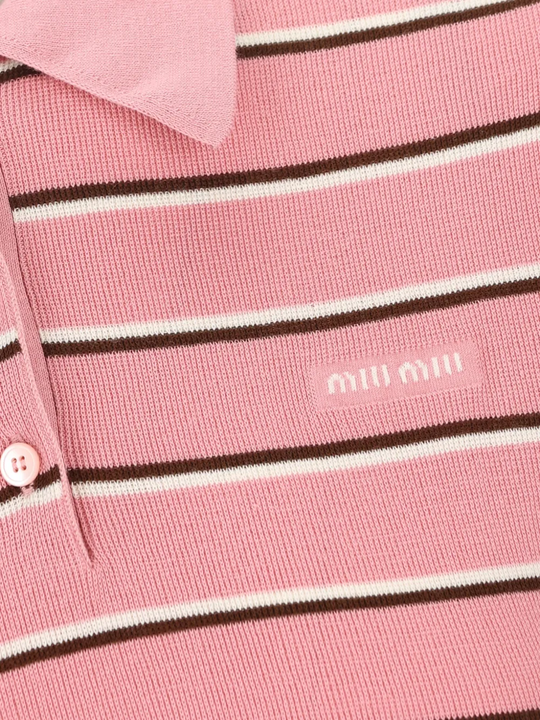 Close up of pink shirt, showing texture of the Cotton fabric