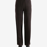 Black pants worn by a person, showing the pants fit