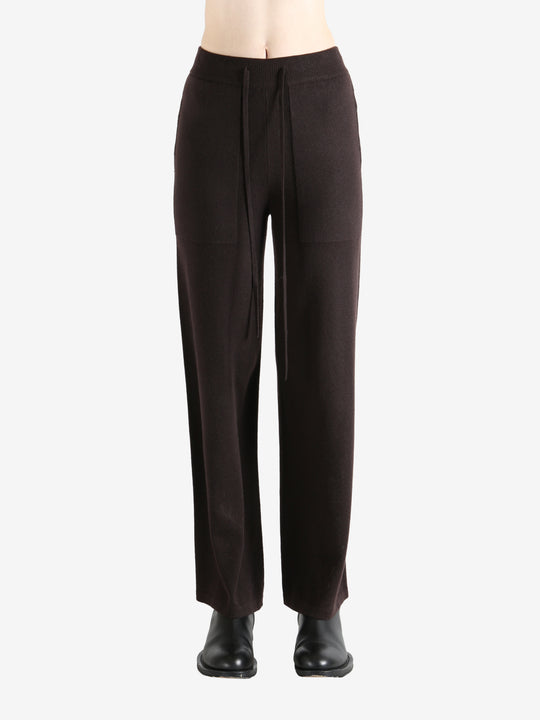 Black pants worn by a person, showing the pants fit