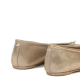 Close up of yellow flats, showing texture of the Goat Leather fabric