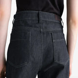 Black pants worn by a person, showing the pants fit