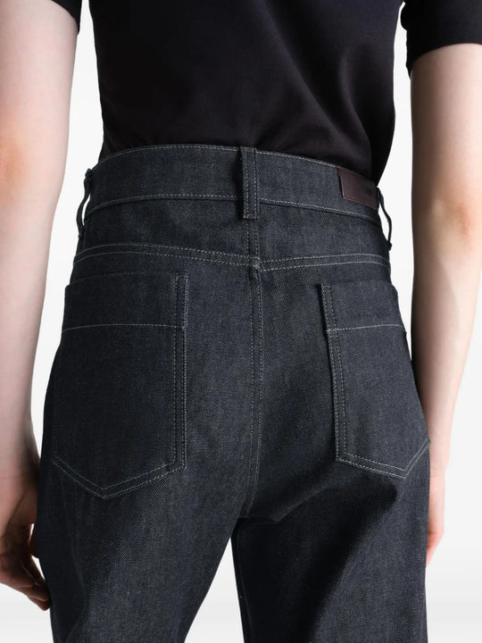 Black pants worn by a person, showing the pants fit