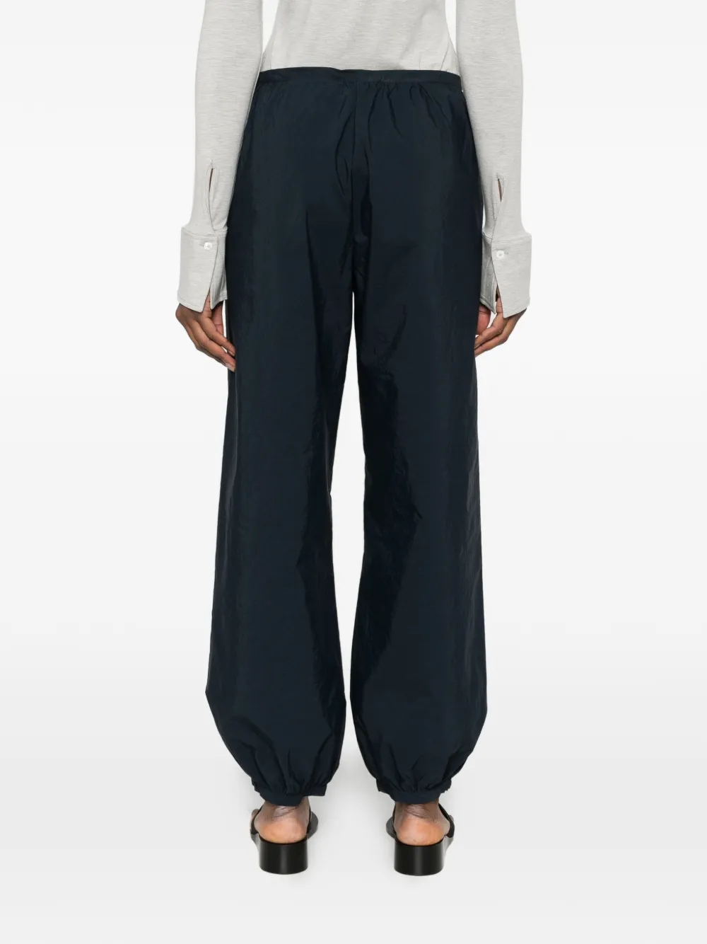 Blue pants worn by a person, showing the blue pants' fit
