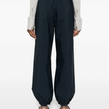 Blue pants worn by a person, showing the blue pants' fit