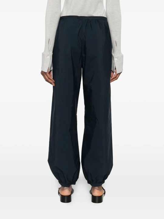Blue pants worn by a person, showing the blue pants' fit