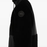Black jacket worn by a person, showing the jacket fit