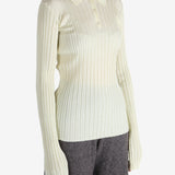 White shirt worn by a person, showing the shirt's fit