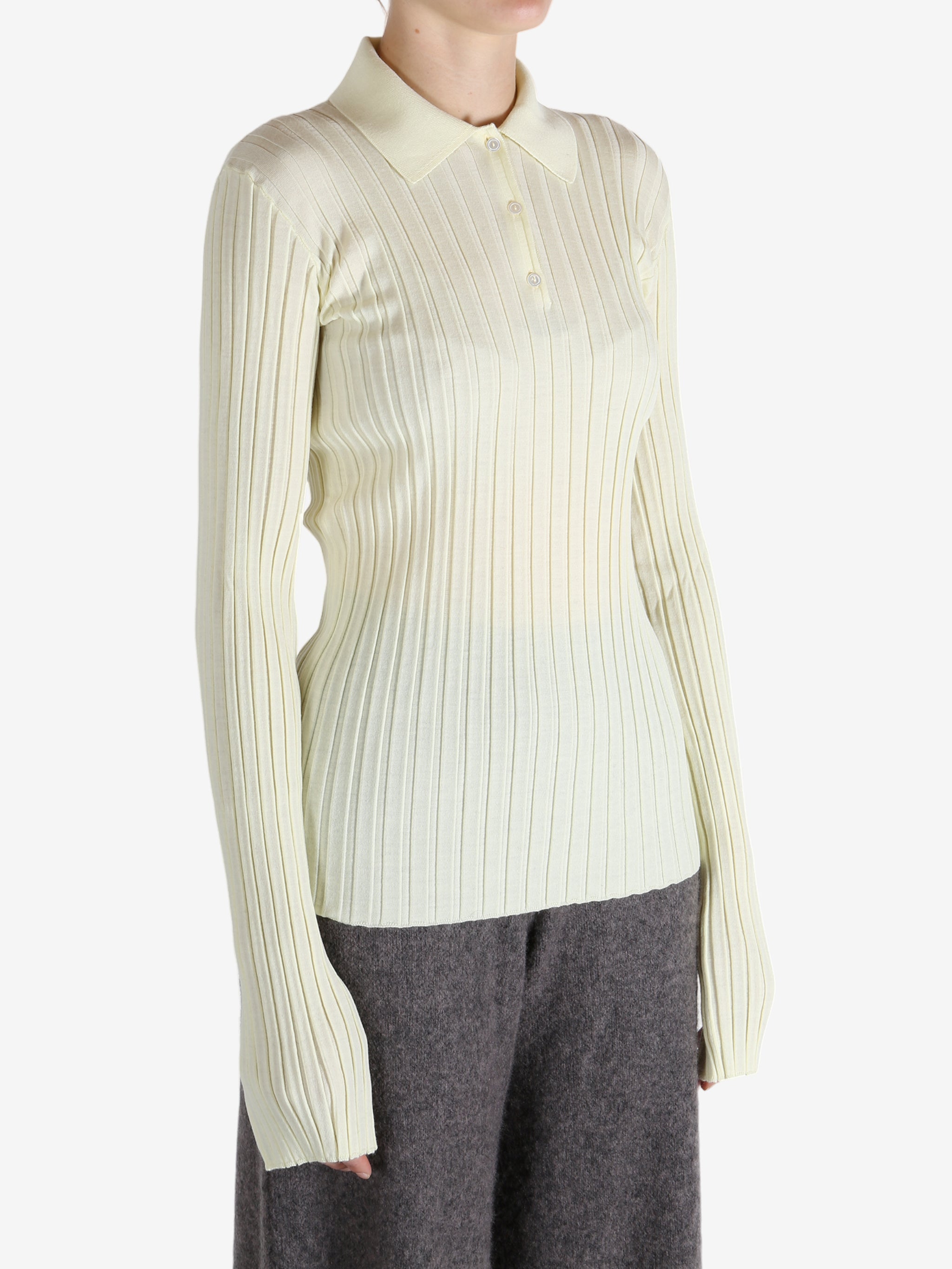 White shirt worn by a person, showing the shirt's fit