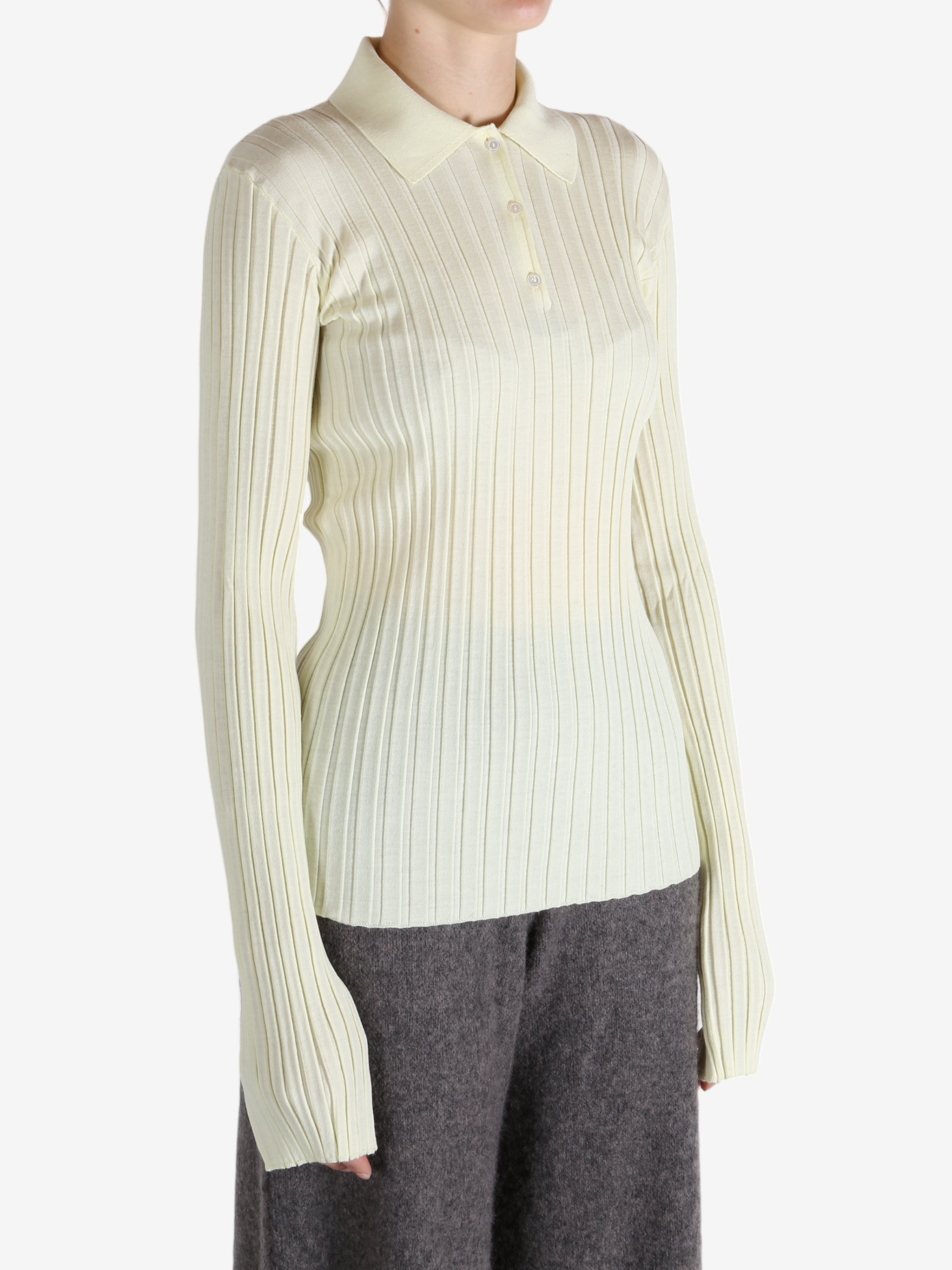 White shirt worn by a person, showing the shirt's fit