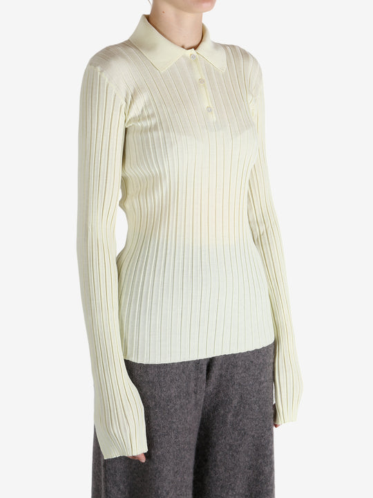 White shirt worn by a person, showing the shirt's fit