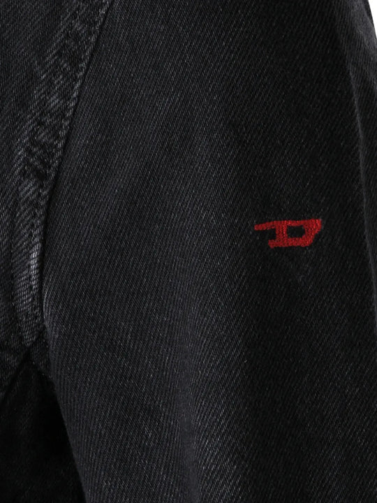 Close up of Black jacket, showing texture of the 82% cotton/ 18% lyocell fabric