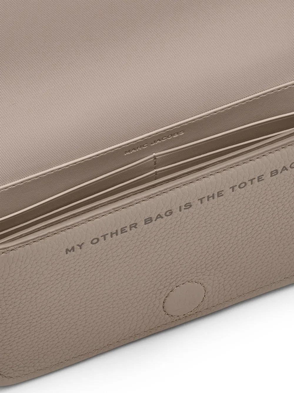 Close up of tan bags, showing texture of the cow leather fabric