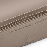 Close up of tan bags, showing texture of the cow leather fabric