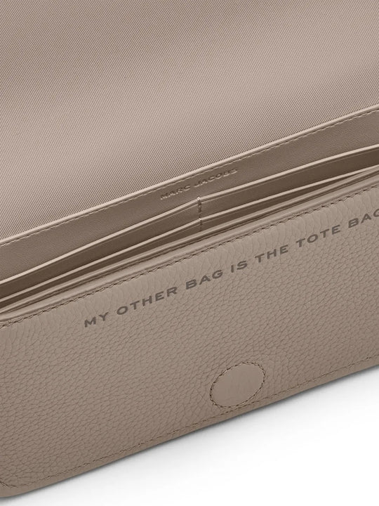 Close up of tan bags, showing texture of the cow leather fabric