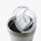 Close up of white cup, showing the detial of the lid