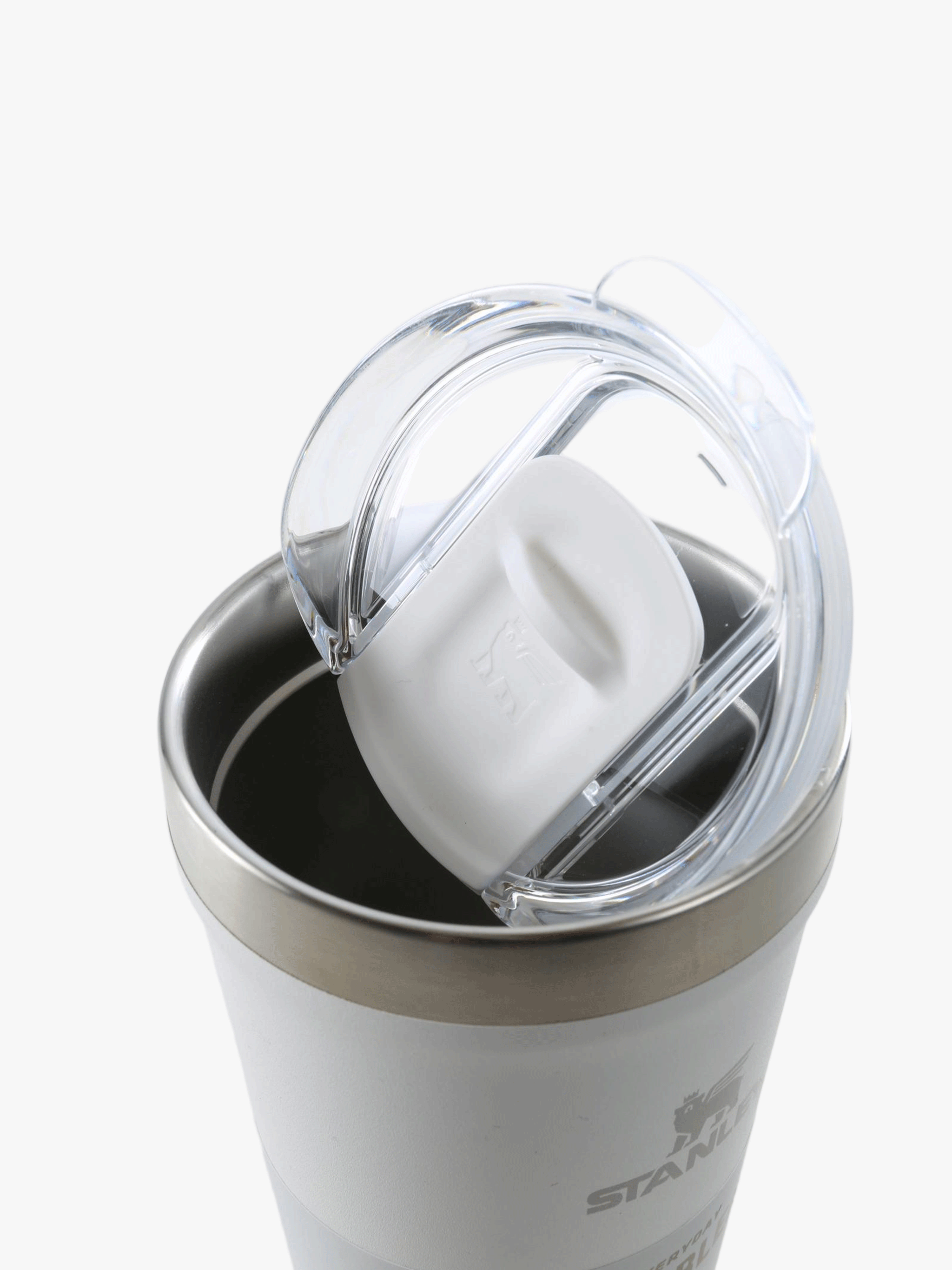 Close up of white cup, showing the detial of the lid