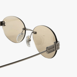 Close up of tan eyewear, showing texture of the UVA/UVB fabric