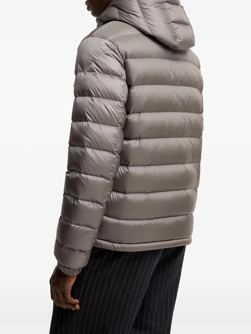 Grey jacket worn by a person, showing the jacket fit