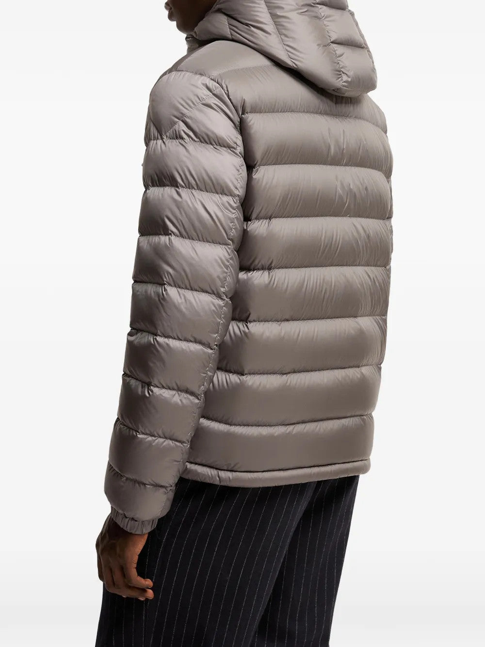 Grey jacket worn by a person, showing the jacket fit