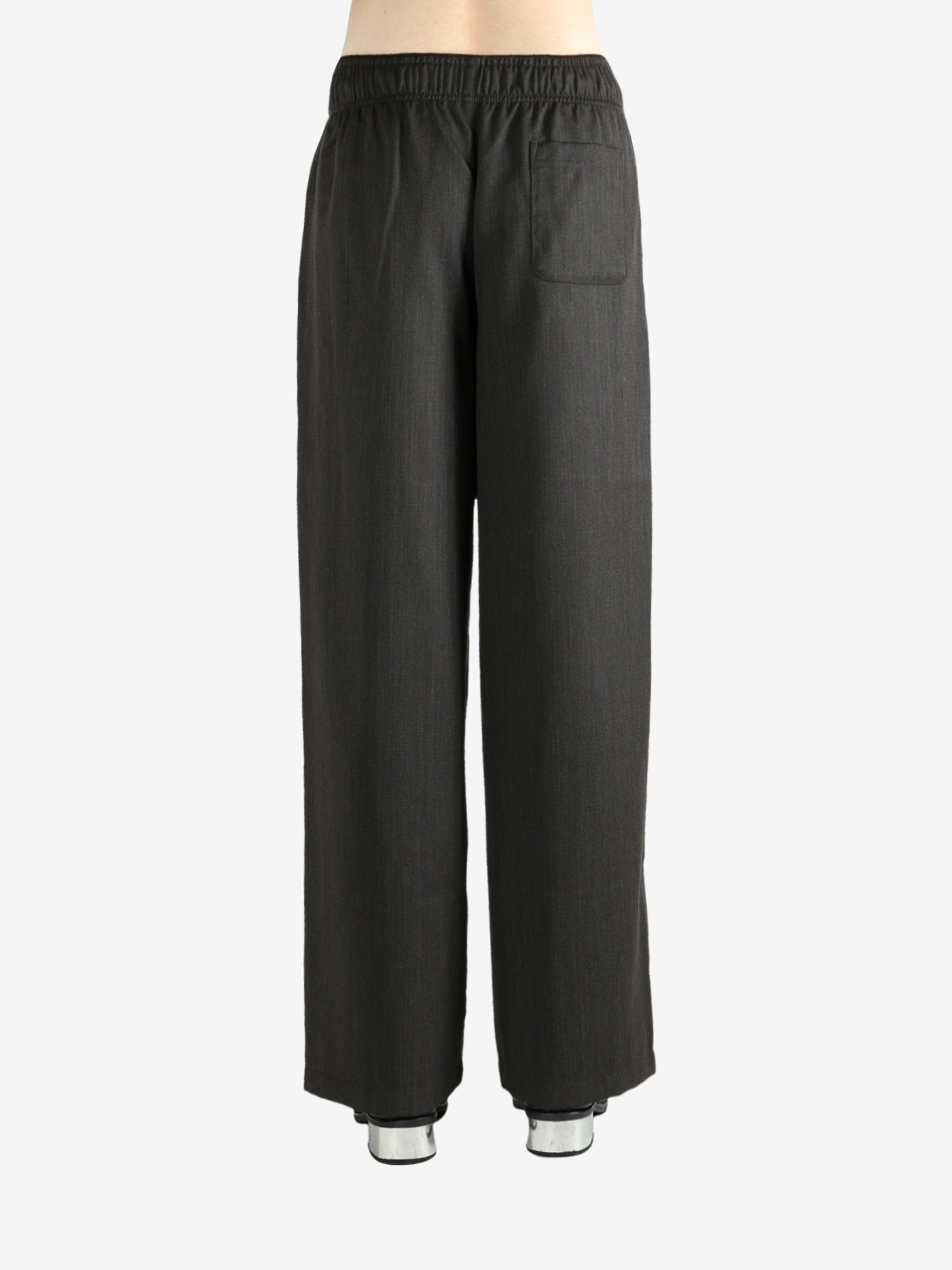 Brown pants worn by a person, showing the pants's fit