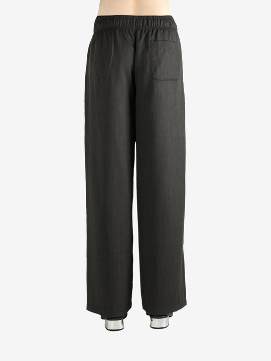 Brown pants worn by a person, showing the pants's fit