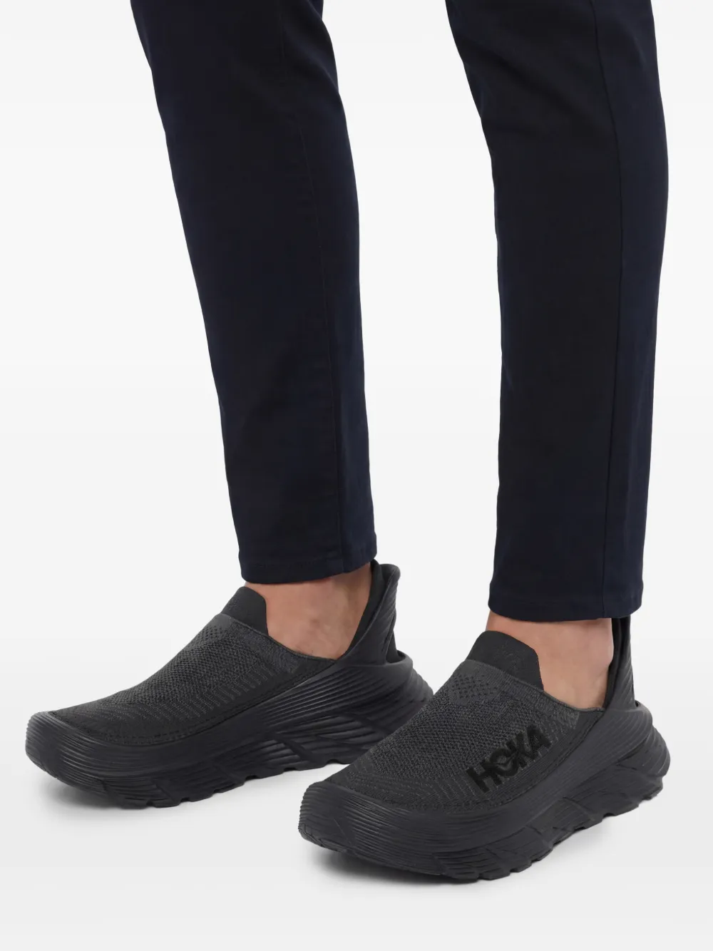 Close up of Black sneakers, showing texture of the rubber fabric
