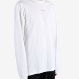 White t-shirt worn by a person, showing the t-shirt fit
