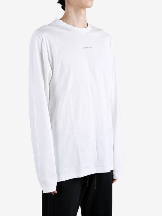 White t-shirt worn by a person, showing the t-shirt fit