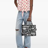 Black bag worn by a person, showing the bag's fit