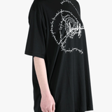 Black t-shirt worn by a person, showing the t-shirt's fit